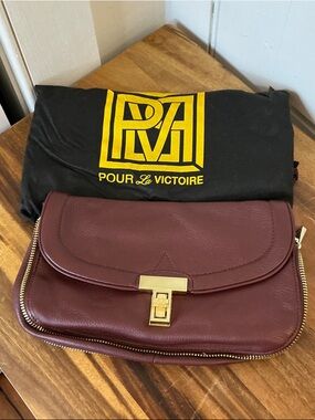 Pour La Victoire Wine/Burgundy Leather Clutch with Gold Hardware